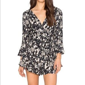 Revolve Free People All the Right Ruffles Romper in Raven Combo